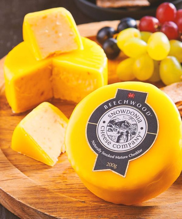 Smoked Cheddar Cheese on Beechwood Logs